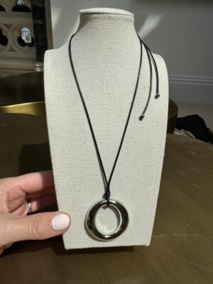 Sample sale number 10-cord necklace with silver hoop.