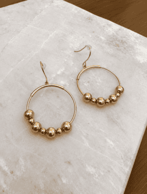 Sample Sale 29-Gold hoop earring with bead detail.